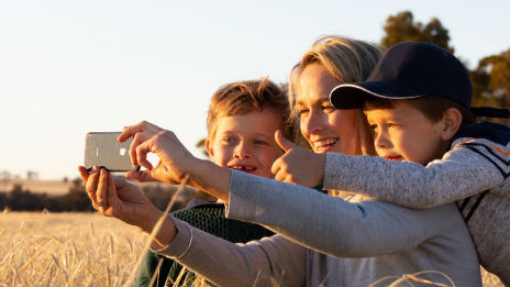 Mother and her two sons taking a selfie.